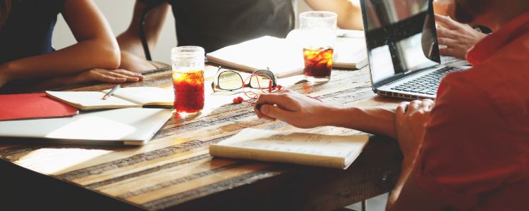 People with drinks at a table